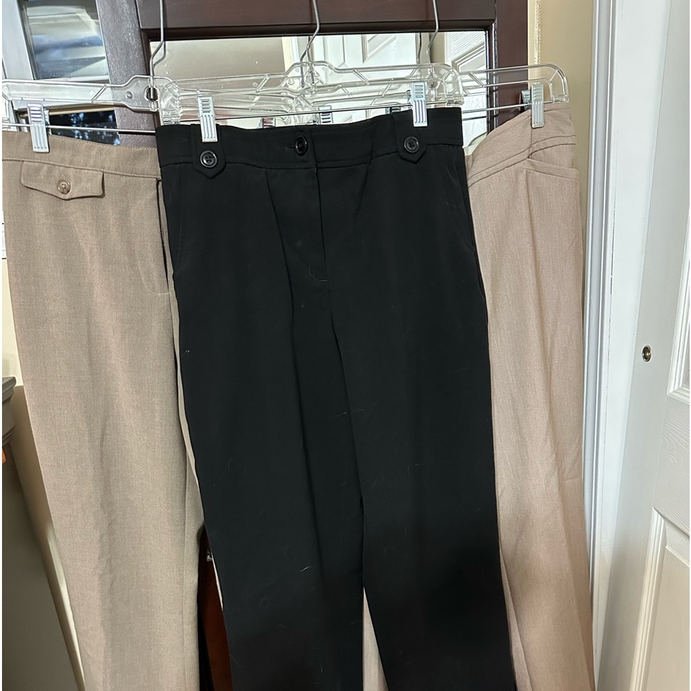 Three pair of slacks sold as a bundle.
